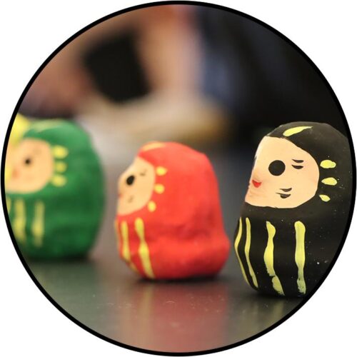 three paper maches dolls