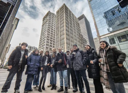 many people gathered in Chicago outside several skyscrapers