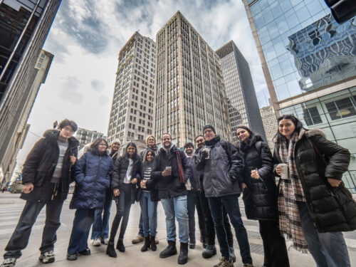 many people gathered in Chicago outside several skyscrapers