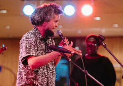 man singing into microphone