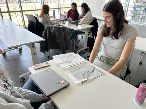 person sitting and working at table